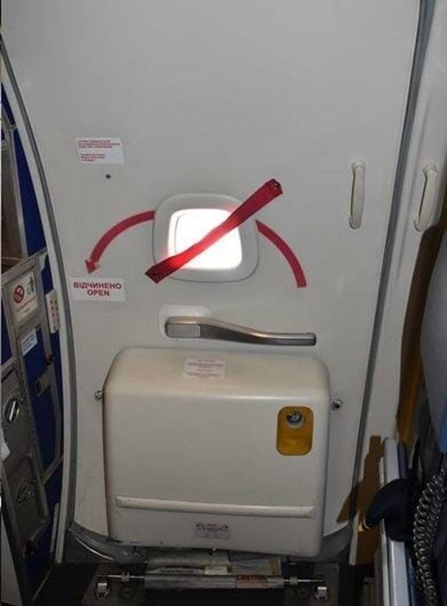 Eagle-eyed passengers may have noticed a bizarre bright red strap which goes across the small window in the plane door. Credit: Vasyatka1 / Artem Katranzhi / Wikimedia