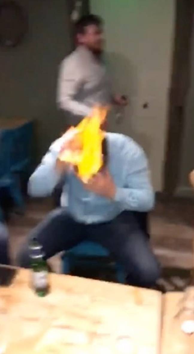 Within seconds each person appears to put their flame out, but one man seemed to struggle and looked to be in serious trouble if it wasn't the help of his friend. Credit: Twitter / @JonnyJohns7