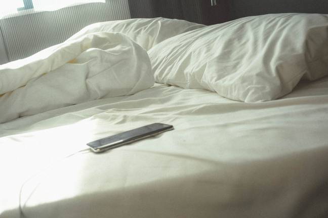 Apple have issued a warning to iPhone users who charge their phones under their pillows as they sleep. Credit: Unsplash
