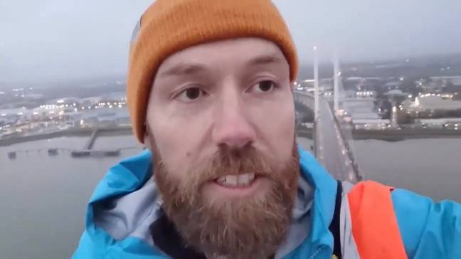 Two of the protestors sparked chaos on the roads in Essex yesterday morning when they climbed all the way up the Queen Elizabeth II Bridge at Dartford crossing. Credit: Just Stop Oil