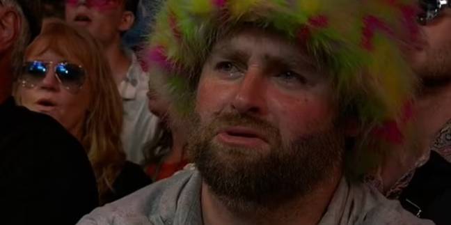 The moment a festival-goer was filmed crying to Elton John. Credit: BBC
