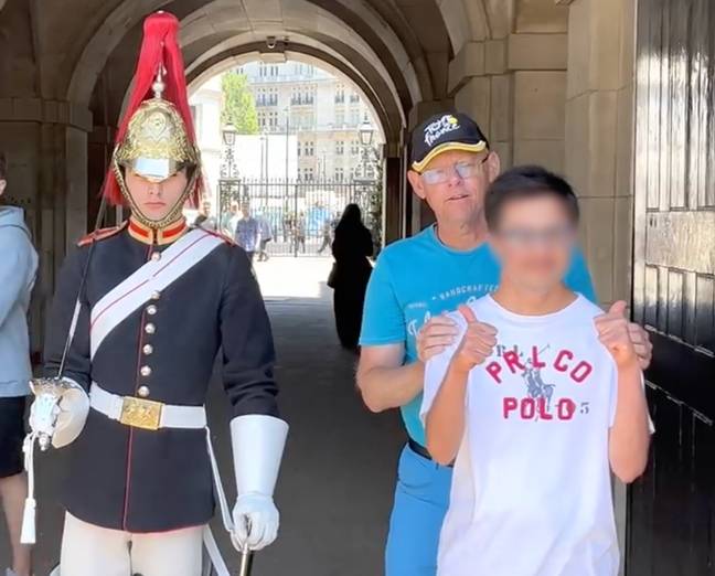 The guard posed for a picture with the pair. Credit: The Royal King’s Guards England