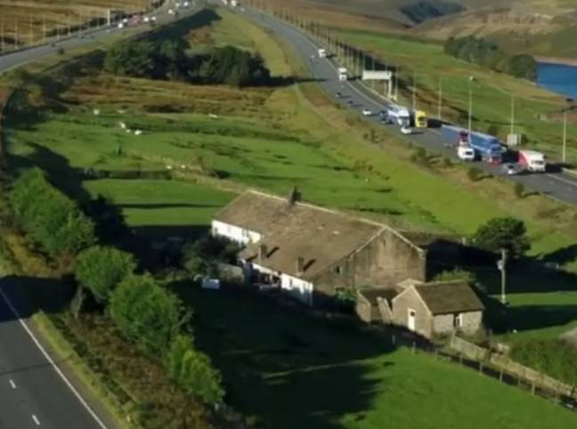 The farmhouse sits in the middle of the four-lane road. Credit: Channel 4