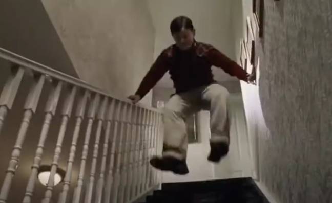 Dudley stomps down the stairs to wake Harry. Credit: Warner Bros.