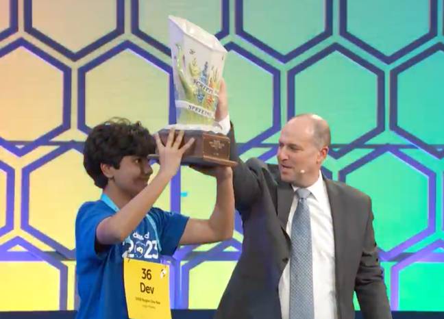 Dev lifts the trophy. Credit: YouTube / Scripps National Spelling Bee