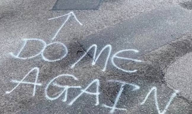 Even some of the potholes already filled in didn't pass muster with the graffiti artist. Credit: BBC