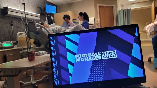 Glenn Walton fired up his laptop to play Football Manager while his partner gave birth. Credit: Caters