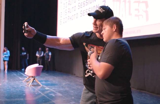 Cena made sure the fan left with a picture. Credit: Monopoly Events