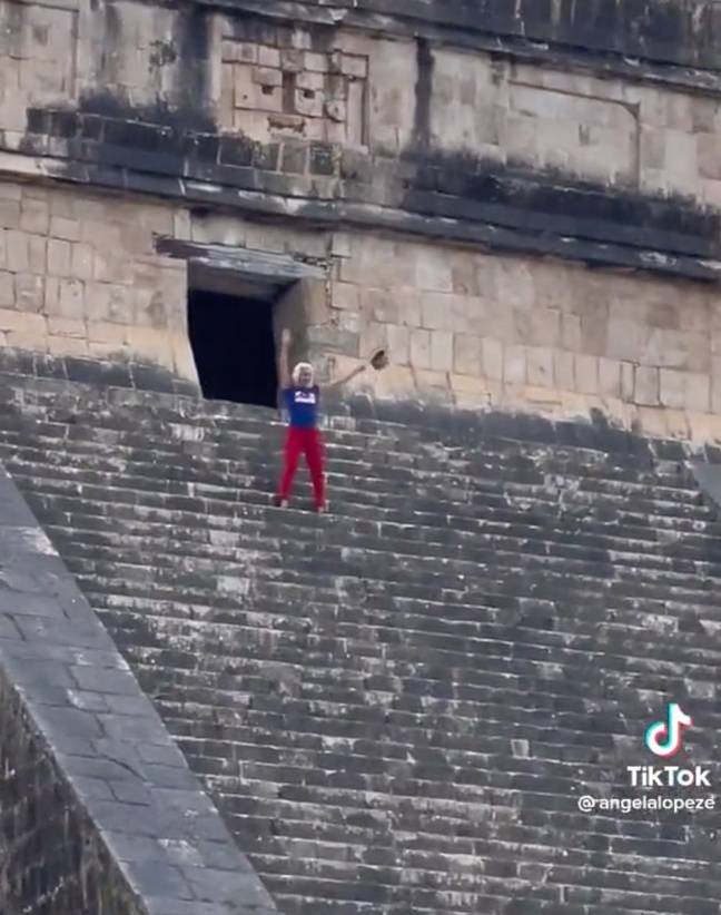 The tourist danced on the pyramid, despite being booed by the mob. Credit: TikTok/@angelalopeze
