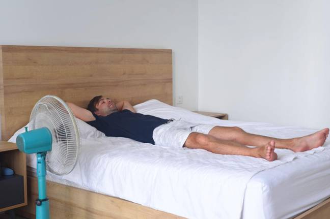 It may be tempting to keep the fan blasting air all night, but you may want to think twice about doing it. Credit: Tatiana Terekhina / Alamy Stock Photo