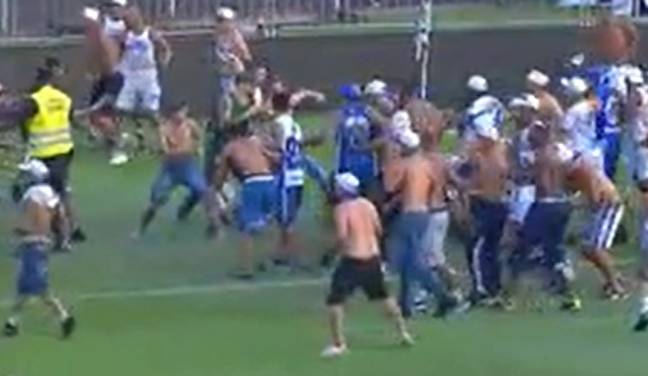 Brawl breaks out at Brazilian football match as fans rush on to pitch