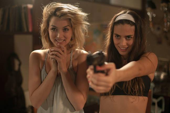Lorenza Izzo and Ana de Armas star as the deadly strangers in the 2015 film. Credit: FlixPix / Alamy Stock Photo