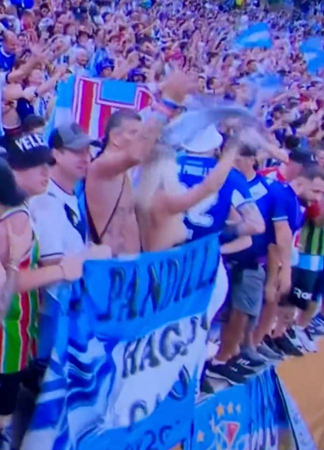 The fan whipped off her top to celebrate. Credit: BBC