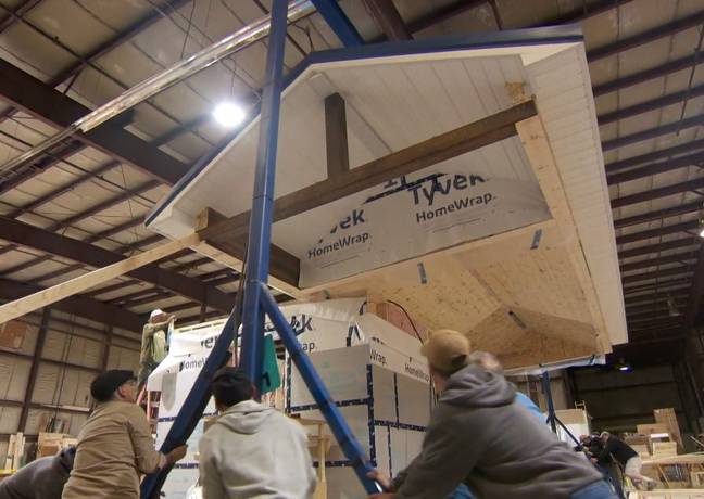Each 'tiny house' is constructed in a warehouse before being loaded onto concrete blocks. Credit: CBC