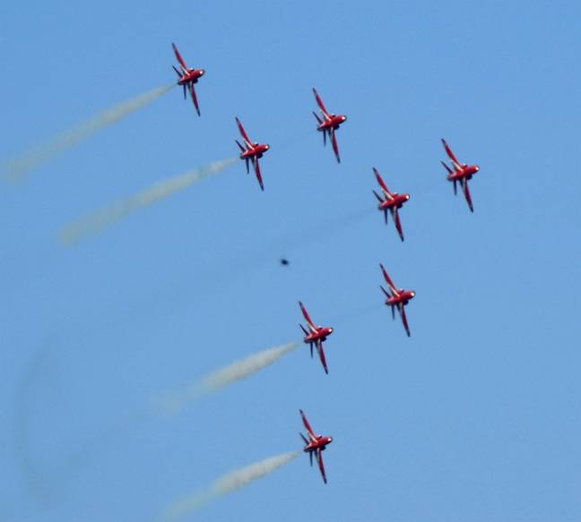 The Red Arrows soaring through the sky, but what's that in the background? Credit: John Mooner/Pen News