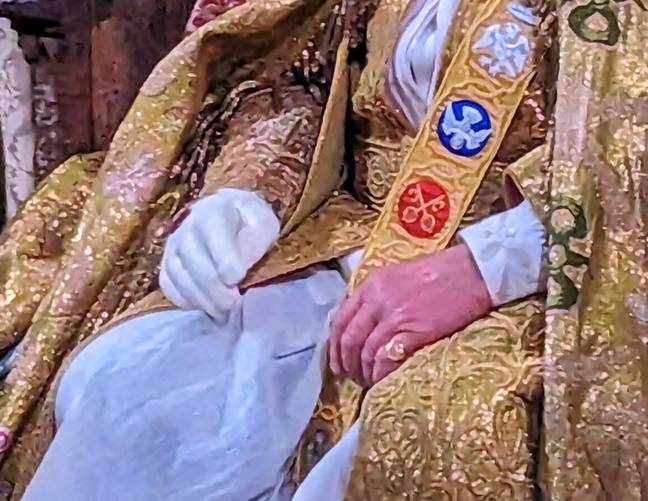 King Charles wore one glove at the coronation. Credit: BBC News