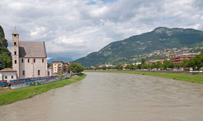 The Adige River runs through Trento and every year some unpopular locals (usually politicians) get dunked in it. Credit: Michael Dutton / Alamy Stock Photo