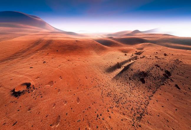 Artist's rendition of the red surface of Mars. Credit: Plrang GFX / Alamy Stock Photo