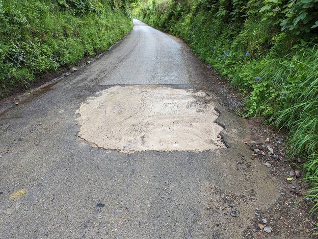 The pothole was filled unofficially. Credit: Facebook/Colin Martin: Cornwall Councillor for Lostwithiel