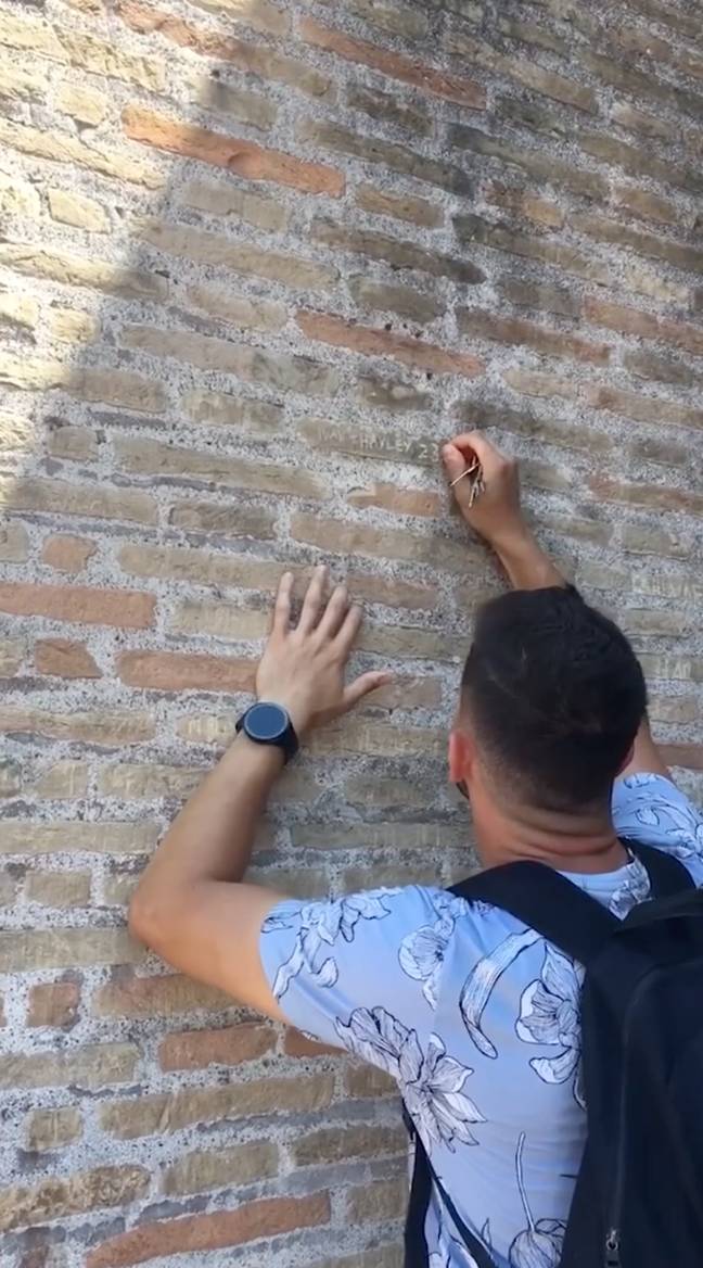 The man went viral for defacing the nearly 2,000 year-old Unesco site. Credit: YouTube/rytz5873