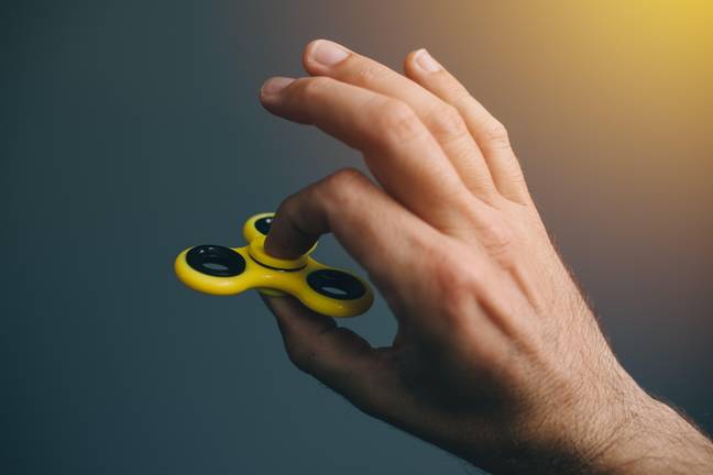 The famous fidget spinner, so named because you fidget with it and it spins. Credit: Igor Stevanovic / Alamy Stock Photo