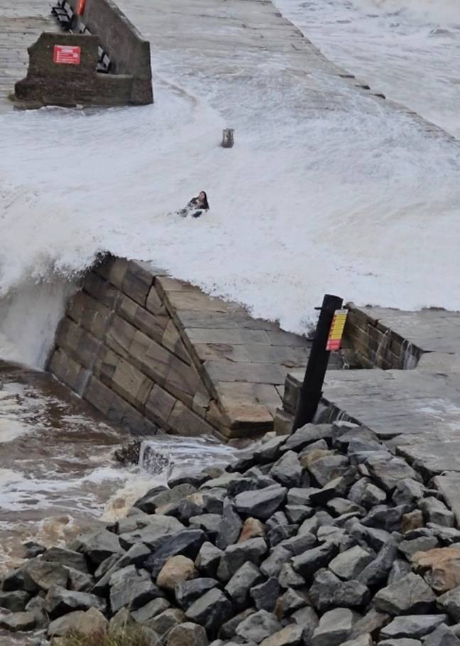 Swept Up In Tourist spotted being swept up in Storm Ciaran after trying to take a ...