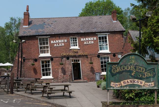 Police are treating the fire at the famous Crooked House pub as arson. Credit: PA