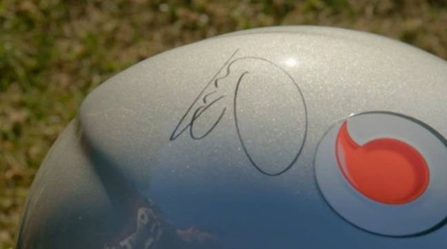 The helmet was signed by Lewis Hamilton. Credit: BBC