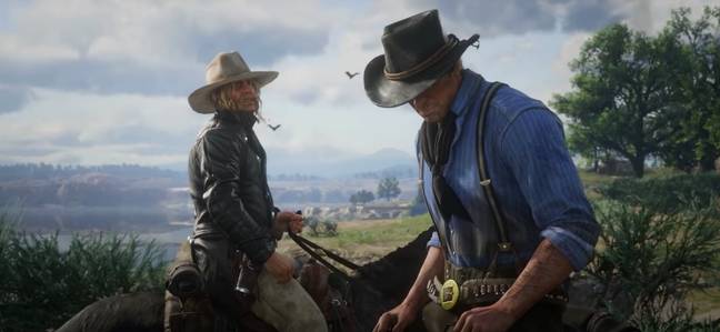 Micah speaks to Arthur Morgan in Red Dead Redemption 2 / Credit: Rockstar Games