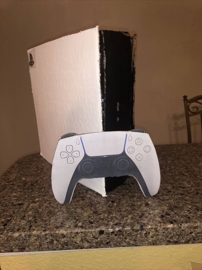 The cardboard PS5 with its cardboard controller / Credit: mckanmille0 on eBay