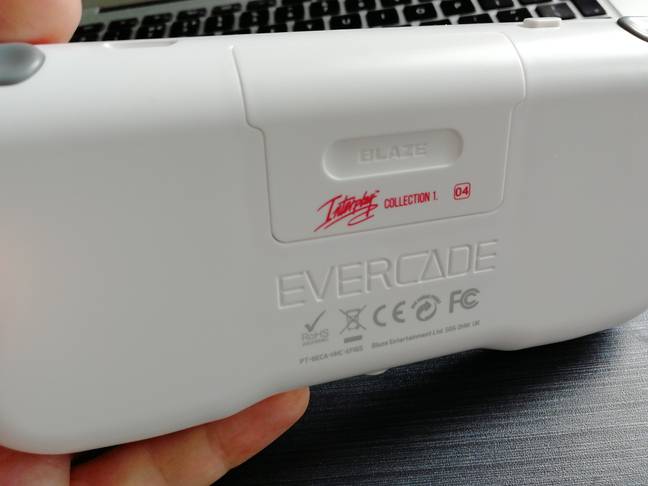 The back of the Evercade, with a cartridge inserted