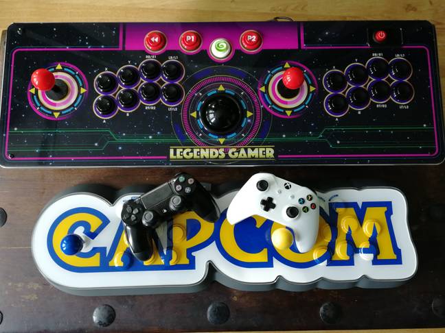 The Legends Gamer Pro next to the Capcom Home Arcade, and console controllers / Credit: the author