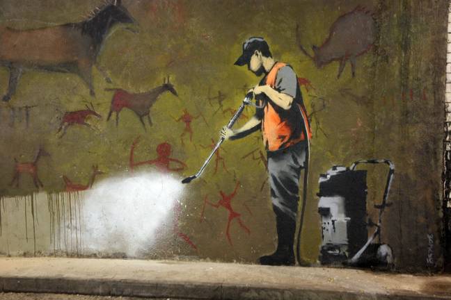 Banksy's iconic 'Cave Painting' in London, 2008. Credit: Alamy