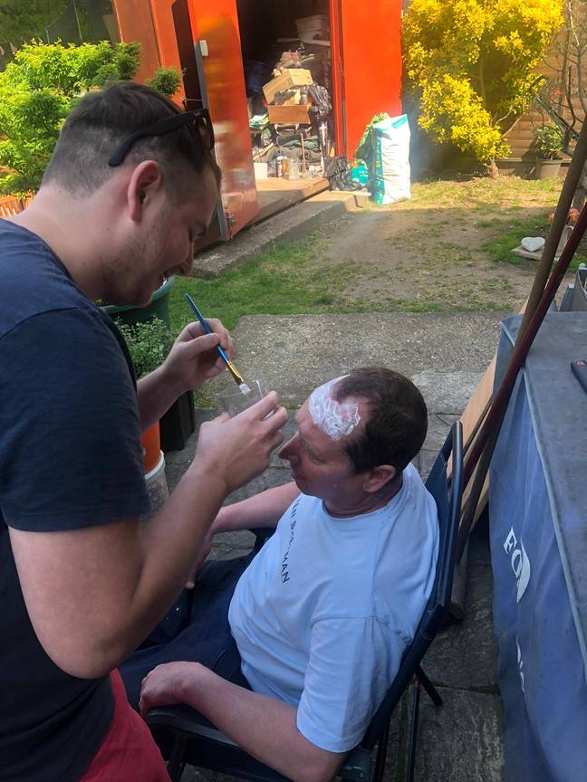Nick used glue to stick his trimmings onto his dad's head. Credit: LADbible