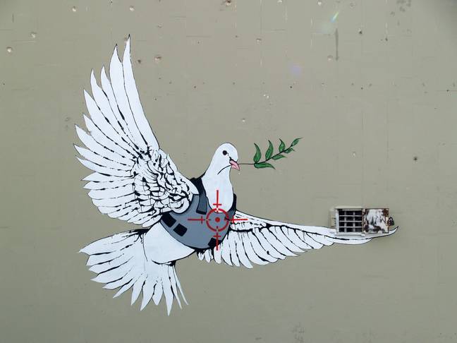 Banksy's 'Dove of Peace' painted on a wall in Bethlehem, West Bank, Palestinian Authority in 2007. Credit: Alamy