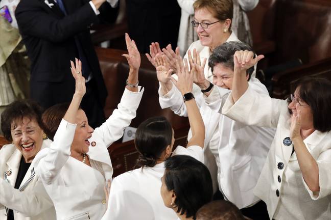 Members of Congress cheer after President Donald Trump acknowledges the record number of women in congress. Credit: PA