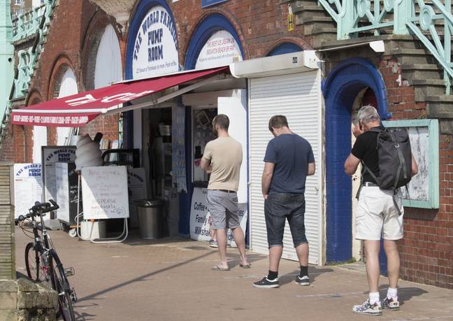 People in Brighton queuing up for ice cream. Credit: i-Images Picture Agency