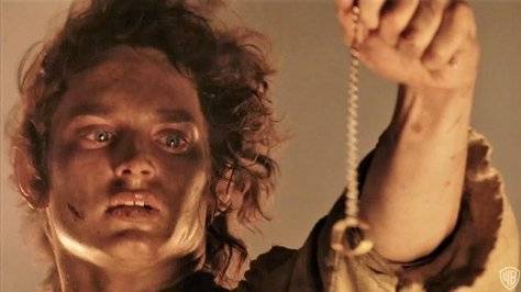Frodo loves this ring a little too much. Credit: New Line Cinema