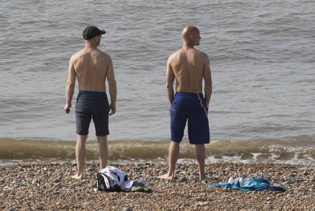 Two men on the beach today. Credit: i-Images Picture Agency
