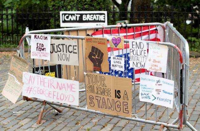 Protest posters outside the US Consulate General office in Edinburgh. Credit: PA