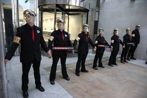 Activists glued themselves to the entrance of the London Stock Exchange. Credit: PA