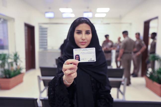 Esraa Albuti showing off her new licence. Credit: PA