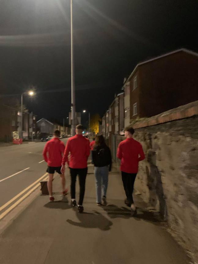 The lads walking a fellow student home. Credit: Kennedy News and Media 