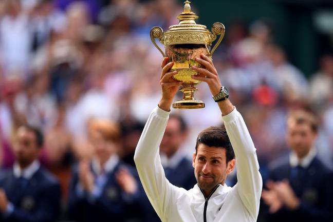 Novak Djokovic with his trophy. Credit: PA