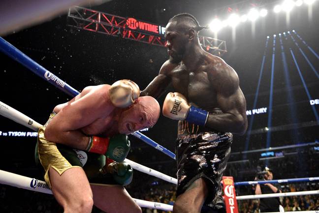 Tyson Fury gets whacked Deontay Wilder. Credit: PA