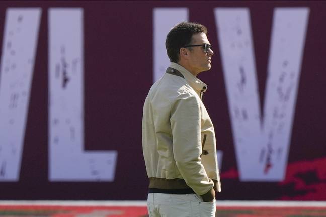 Brady wanders the stadium without a mask. Credit: PA