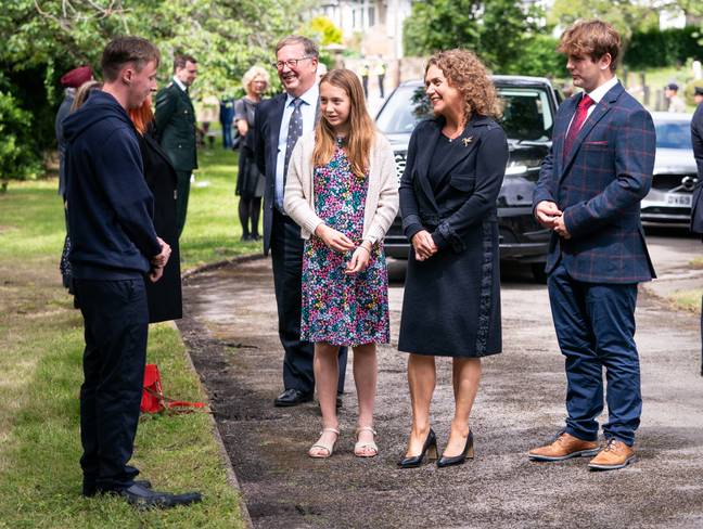 Tom Moore's family at the funeral service. Credit: PA