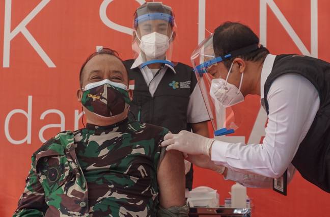 Bali province government top officials are injected with the Sinovac vaccine. Credit: PA