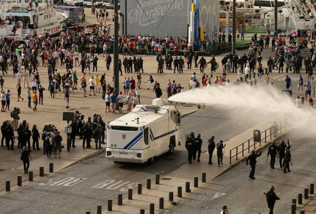 Police use water cannons to split Russian and English fans at the Euros. Image: PA Images