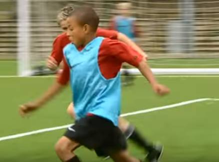 A young Jesse Lingard attempting to beat his man (Credit: MUTV)